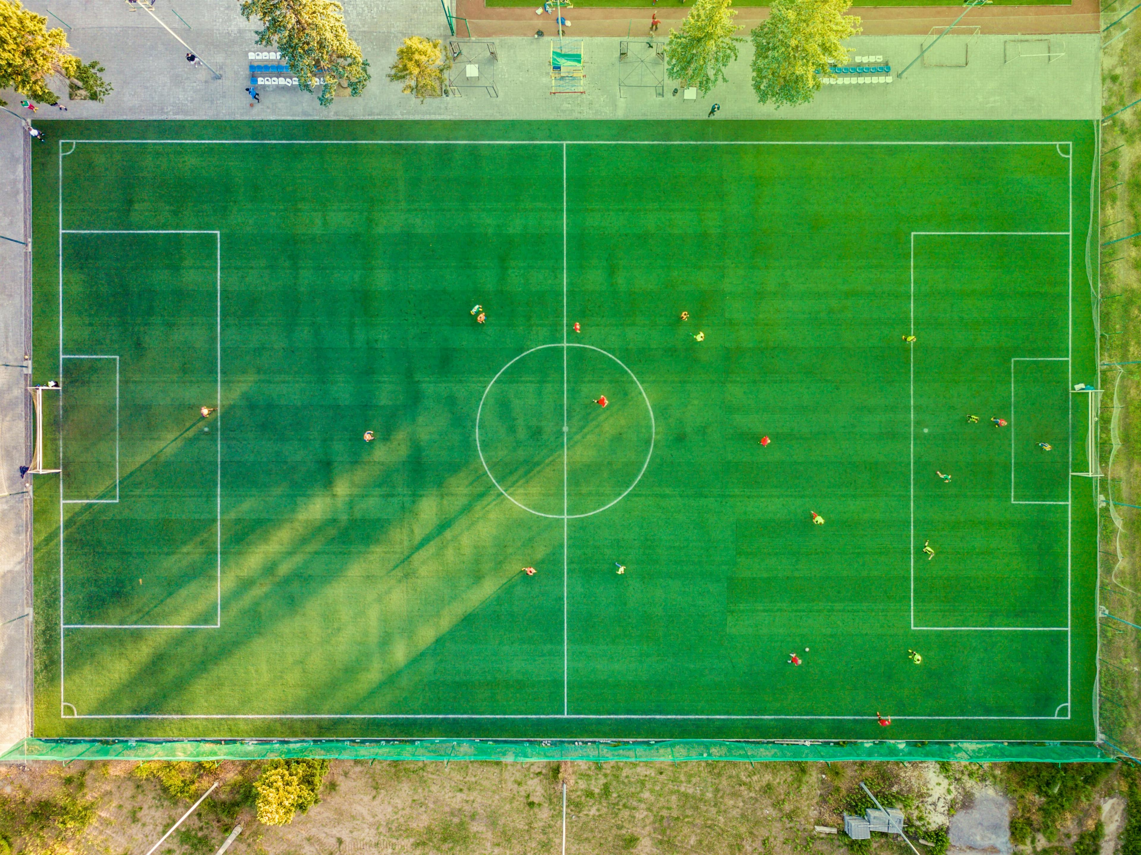 Football coach training young players